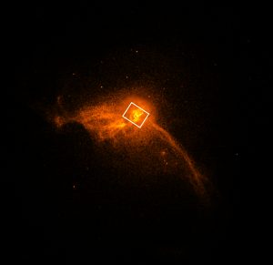 Image of luminous gas at the core of the M87 galaxy, marked with the position of the black hole and its accretion disk